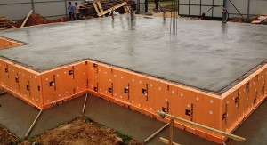 Строительство надежного фундамента на основе монолитной плиты из бетона